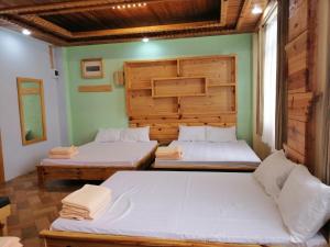 Una cama o camas en una habitación de Sagada Lodging Home