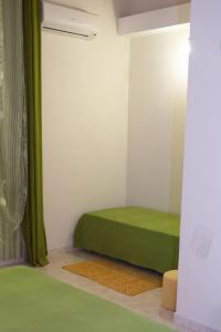 A bed or beds in a room at Casa Vacanze Calafarina