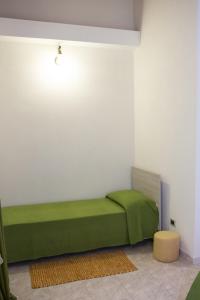 A bed or beds in a room at Casa Vacanze Calafarina
