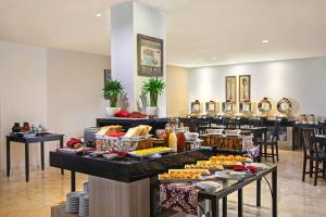 a buffet line with many different types of food at Swiss-Belinn Cibitung in Cibitung