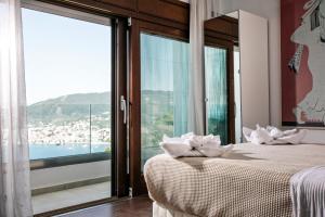 Postel nebo postele na pokoji v ubytování Magdani Private Residences + 26 fotografií
