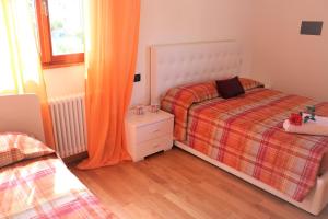 A bed or beds in a room at Villa Ginny