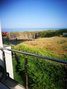 a view of the ocean from the balcony of a boat at Aparthotel Afrodita 2 in Sinemorets +1 photo