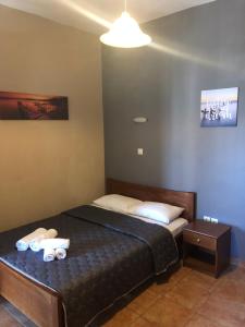 a bedroom with a bed with two towels on it at Villa Un bel posto Sea View in Nea Vrasna