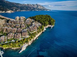 an aerial view of a resort on a island in the water at Dukley Hotel & Resort in Budva