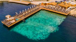 an aerial view of a dock in the water at Hotel Vita Bella Resort & Spa in Gundogan