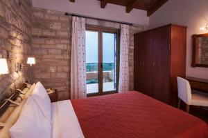 Postel nebo postele na pokoji v ubytování Enastron Villas