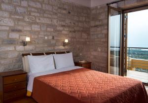 Postel nebo postele na pokoji v ubytování Enastron Villas