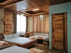 Una cama o camas en una habitación de Sagada Lodging Home