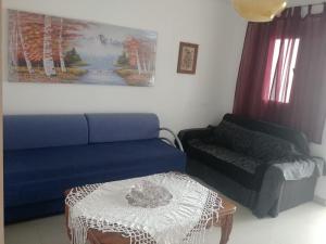 a living room with a couch and a table at Apartment for relaxing and for health in Haifa