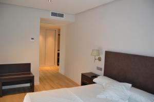 Postel nebo postele na pokoji v ubytování Hotel Villegas