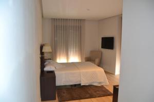 Postel nebo postele na pokoji v ubytování Hotel Villegas