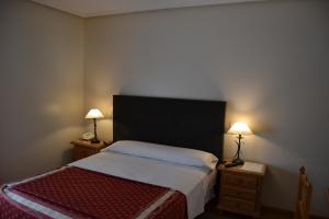 Postel nebo postele na pokoji v ubytování Hotel Villegas