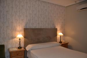 Postel nebo postele na pokoji v ubytování Hotel Villegas