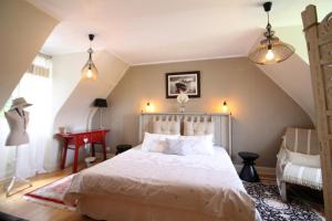 Ένα ή περισσότερα κρεβάτια σε δωμάτιο στο La maison de l'Odet +34 φωτογραφίες