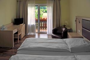 Letto o letti in una camera di Hotel Tannenhof