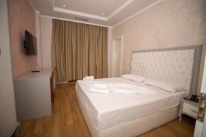 Voodi või voodid majutusasutuse Hotel Vila Zeus toas