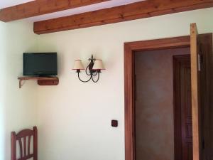 TV tai viihdekeskus majoituspaikassa Hospedaje Casa Amalia