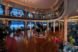 a living room and dining room on a cruise ship at Le Theatre Cruises - Wonder on Lan Ha Bay in Ha Long