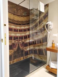 a shower stall with a mural of a theatre at City Soul B&B in Naples +90 photos