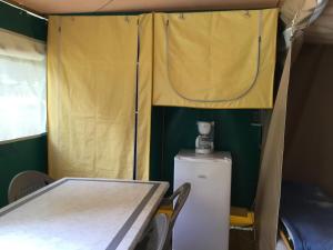Postel nebo postele na pokoji v ubytování Camping Le Canoë