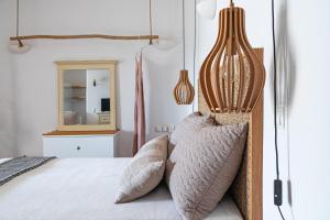 A bed or beds in a room at Ornos Blue