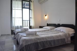 A bed or beds in a room at Arellis