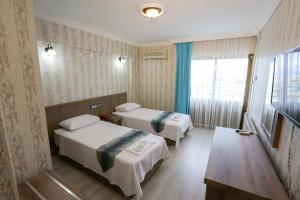Postel nebo postele na pokoji v ubytování Cagdas Hotel + 14 fotografií