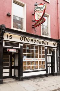a donut shop with a clock on top of it at O'Donoghue's in Dublin