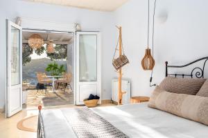 A bed or beds in a room at Ornos Blue