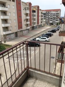 a balcony with a view of a parking lot at Apartman Centar in Trebinje