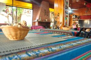 a table with a basket on top of it at Hotel La Marina in Villa Carlos Paz