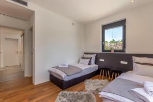 Postel nebo postele na pokoji v ubytování Luxury Villa Quadra
