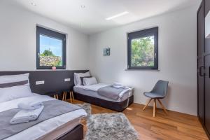 Postel nebo postele na pokoji v ubytování Luxury Villa Quadra