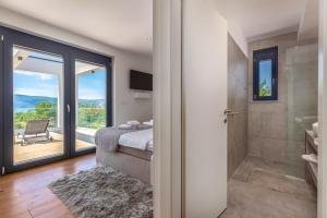 Postel nebo postele na pokoji v ubytování Luxury Villa Quadra