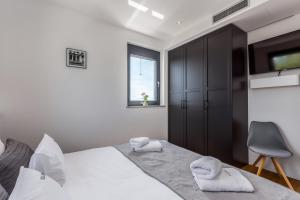 Postel nebo postele na pokoji v ubytování Luxury Villa Quadra