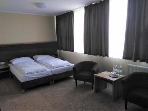Posteľ alebo postele v izbe v ubytovaní Hotel Cargo