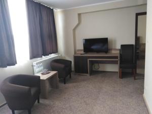 TV a/nebo společenská místnost v ubytování Hotel Cargo