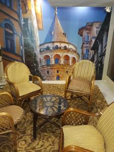 a room with chairs and a table and a building at Hali Hotel in Istanbul