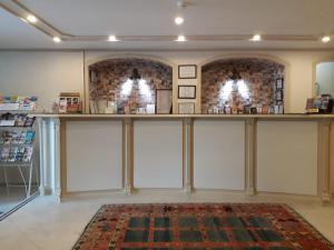 a room with white sliding doors and a rug at Hali Hotel in Istanbul