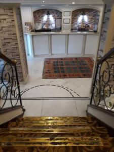 a room with a staircase with rugs on the floor at Hali Hotel in Istanbul