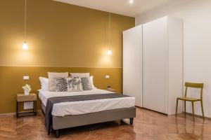 Posteľ alebo postele v izbe v ubytovaní Elegante appartamento da 6 Blu&Oro