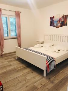 Posteľ alebo postele v izbe v ubytovaní Apartments Biba