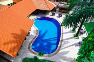 an overhead view of a large blue swimming pool at Riviera Taouyah Hotel in Conakry