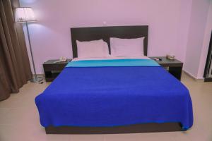 Ein Bett oder Betten in einem Zimmer der Unterkunft Riviera Taouyah Hotel