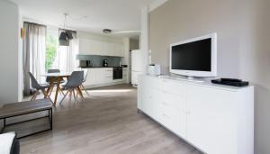 TV a/nebo společenská místnost v ubytování Ferienwohnung Wilhelmstraße