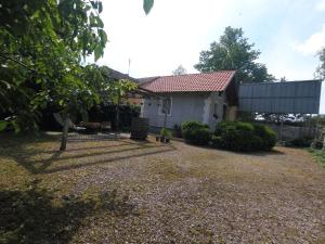 a house with a gravel yard in front of it at Hostel Respect in Pančevo +16 photos