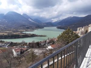 a view of a lake from a balcony at Casa vacanze a Barrea in Barrea +4 photos