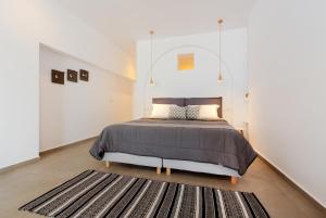 Voodi või voodid majutusasutuse Sigalas Beach Hotel toas