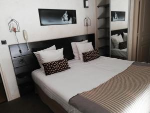 Postel nebo postele na pokoji v ubytování hôtel Le Synaya